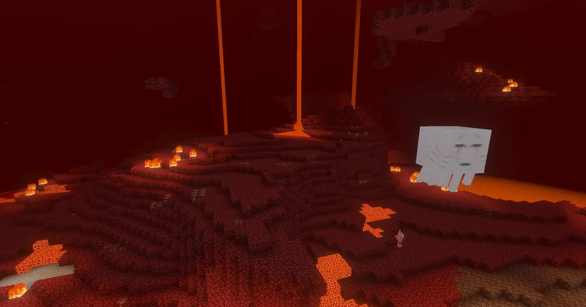 The Nether wastes, netherrack cliffs and lava under a red haze